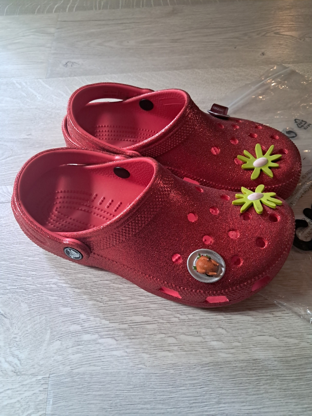 CROCS Glitter Red Clogs with Green Daisy Charms